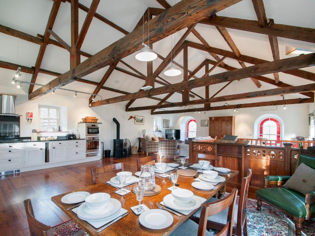 a kitchen and dining room with a table and chairs at The Old Chapel in Gammersgill