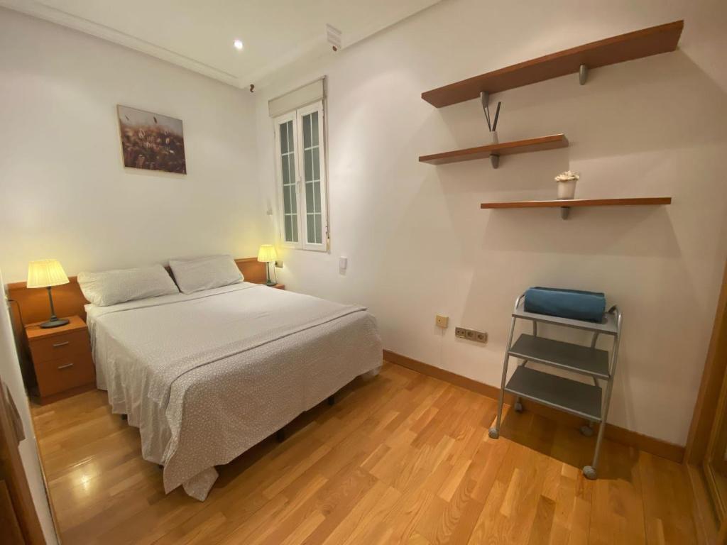 A bed or beds in a room at Homy Gran Via