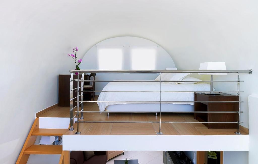 Postel nebo postele na pokoji v ubytování Macaris Suites & Spa