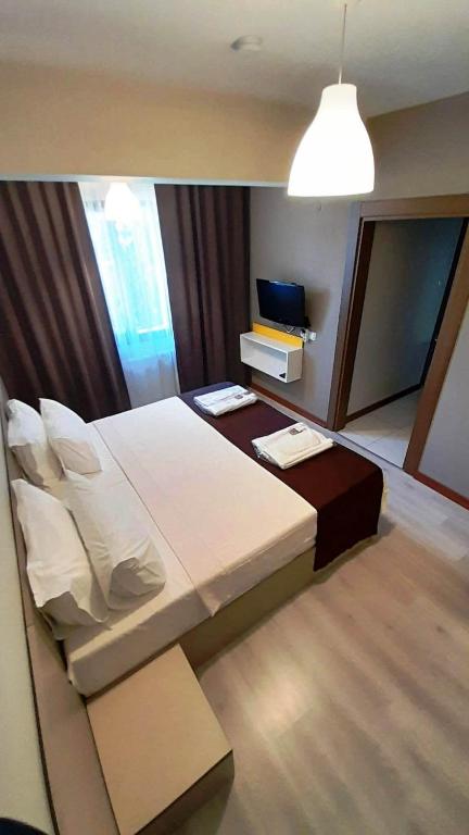 Postel nebo postele na pokoji v ubytování Moda Hotel