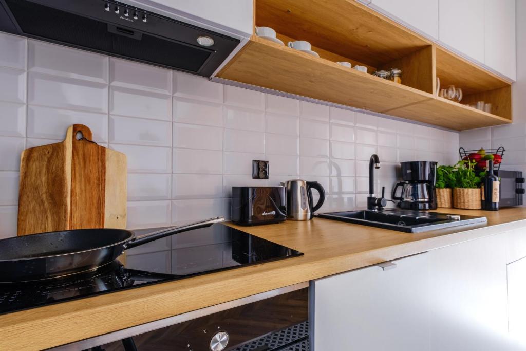 Kuchyňa alebo kuchynka v ubytovaní APARTAMENTY NOVA BIAŁKA