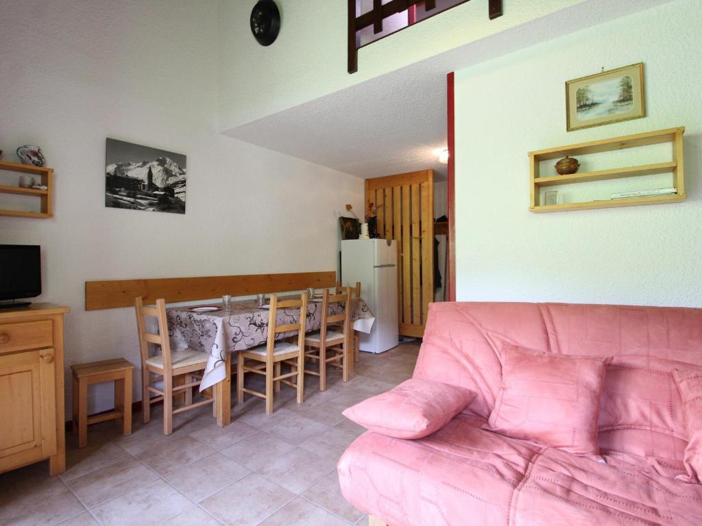 a living room with a couch and a dining room at Appartement Lanslevillard, 2 pièces, 6 personnes - FR-1-508-112 in Lanslevillard