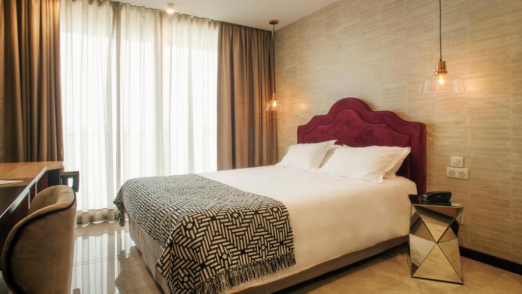 Postel nebo postele na pokoji v ubytování Hotel La Pietra Restaurant & Spa