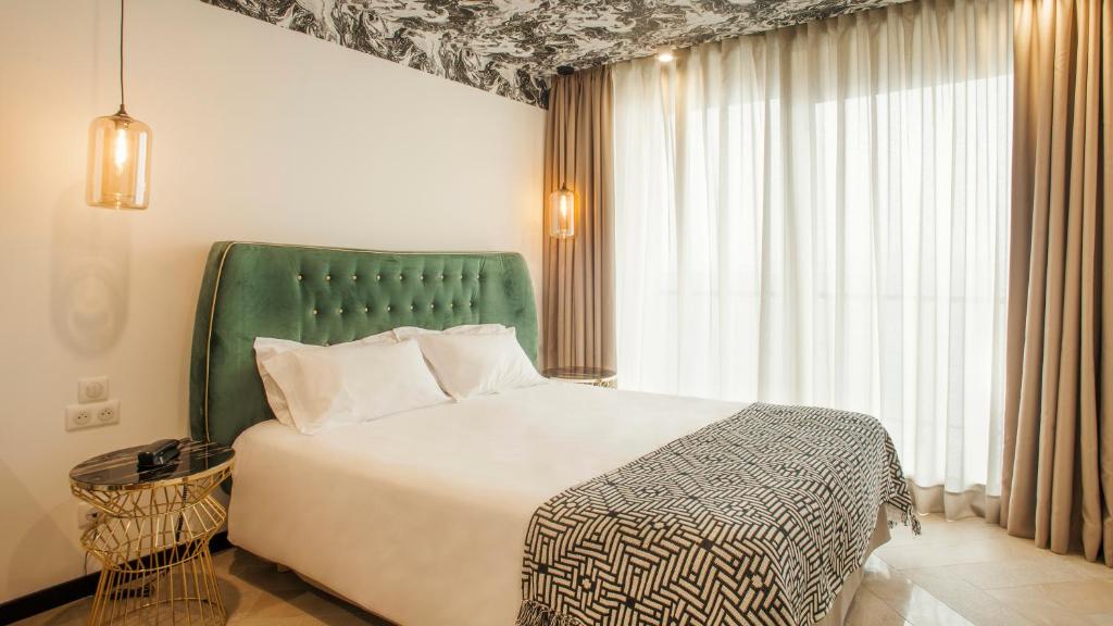 Postel nebo postele na pokoji v ubytování Hotel La Pietra Restaurant & Spa