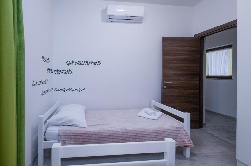 Postel nebo postele na pokoji v ubytování Villa Mateo