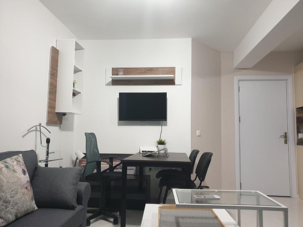 A television and/or entertainment centre at New The Twins Varna Two-Bedroom, Apt 5 at 15 Tsani Ginchev Street, floor 3
