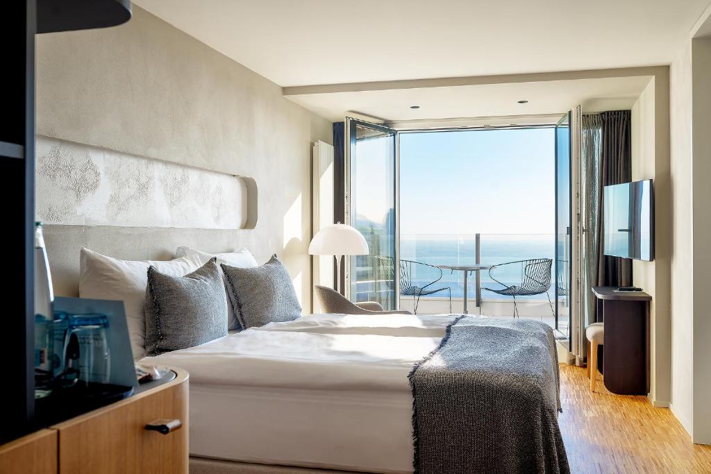 Postel nebo postele na pokoji v ubytování Hotel Heiden - Wellness am Bodensee