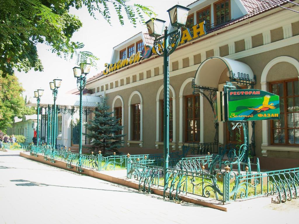 a building with a bunch of benches in front of it at Zolotoy Fazan in Mykolaiv