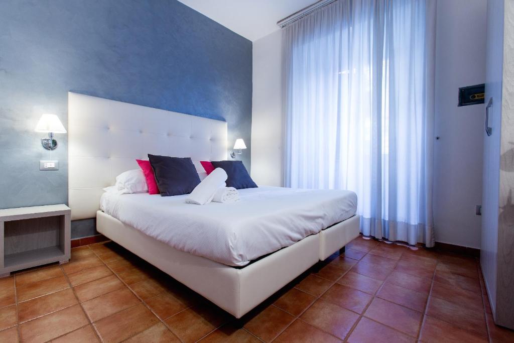 Postel nebo postele na pokoji v ubytování Hotel Gabriella
