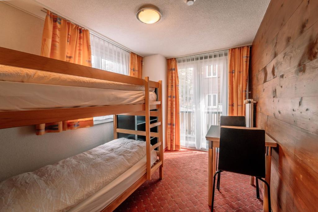 Postel nebo postele na pokoji v ubytování Hotel Les Amis
