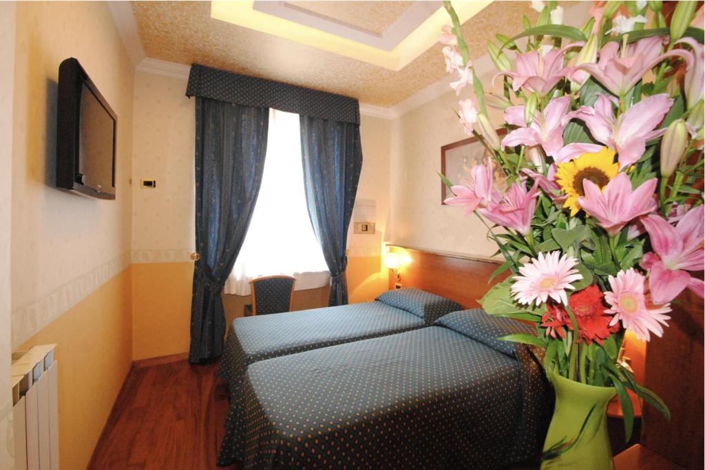 Posteľ alebo postele v izbe v ubytovaní Hotel Verona Rome