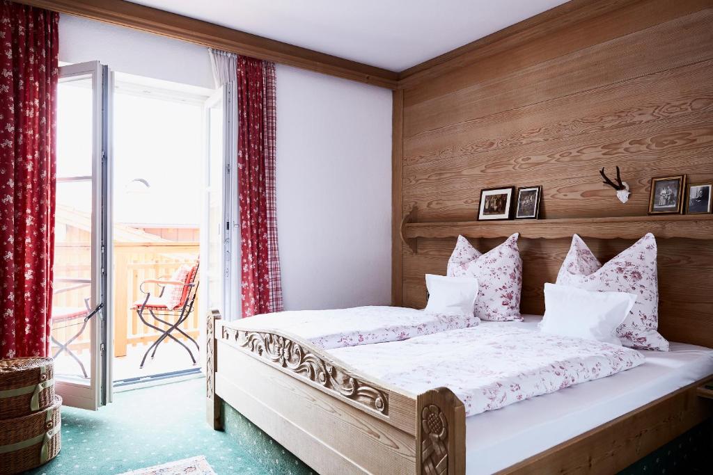 Postel nebo postele na pokoji v ubytování Gasthof-Hotel Dannerwirt