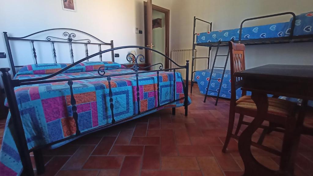 Postel nebo postele na pokoji v ubytování il Chiassetto Agriturismo No Kids