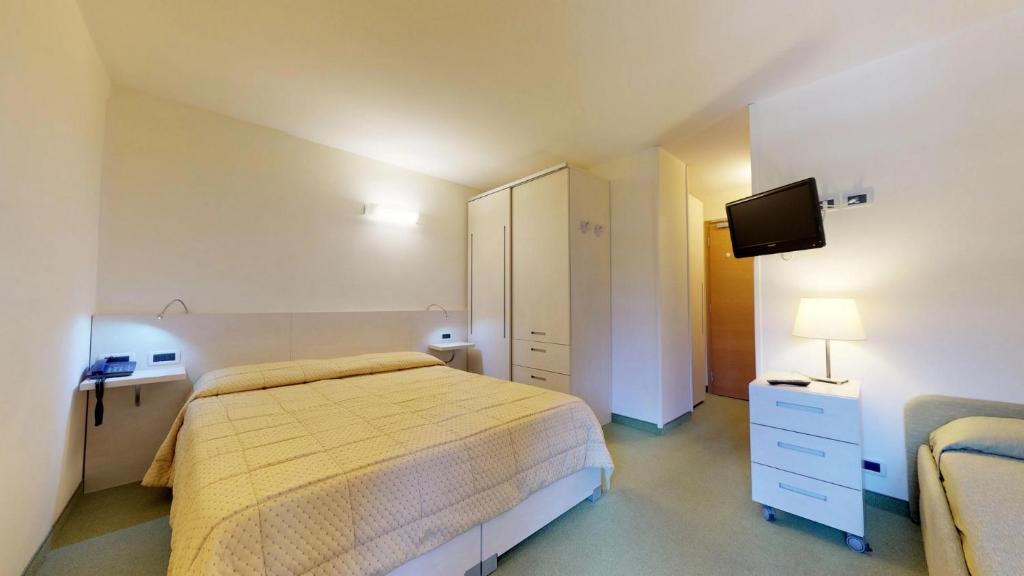 Postel nebo postele na pokoji v ubytování Hotel Alaska