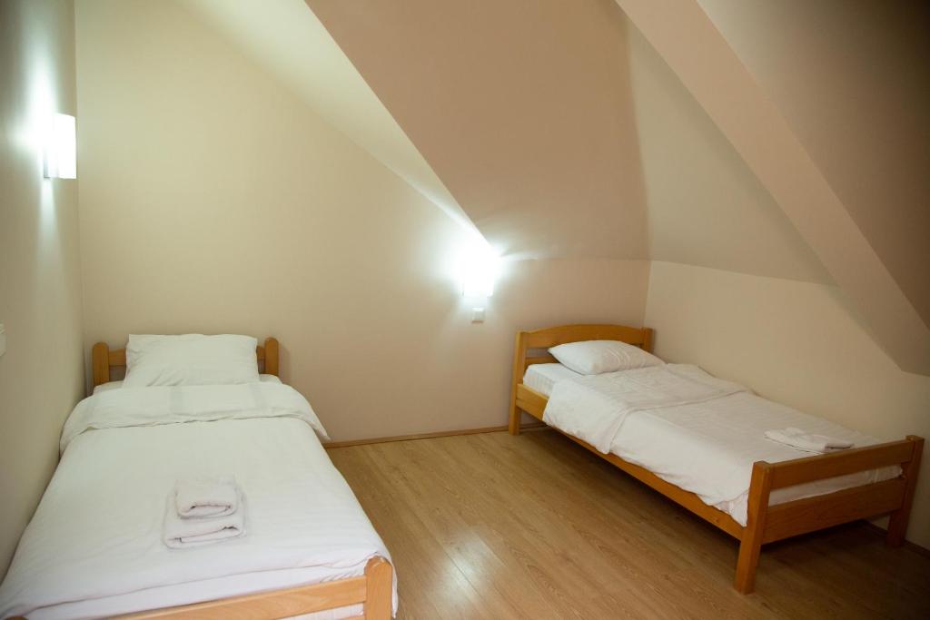 Postel nebo postele na pokoji v ubytování Motel Imperija