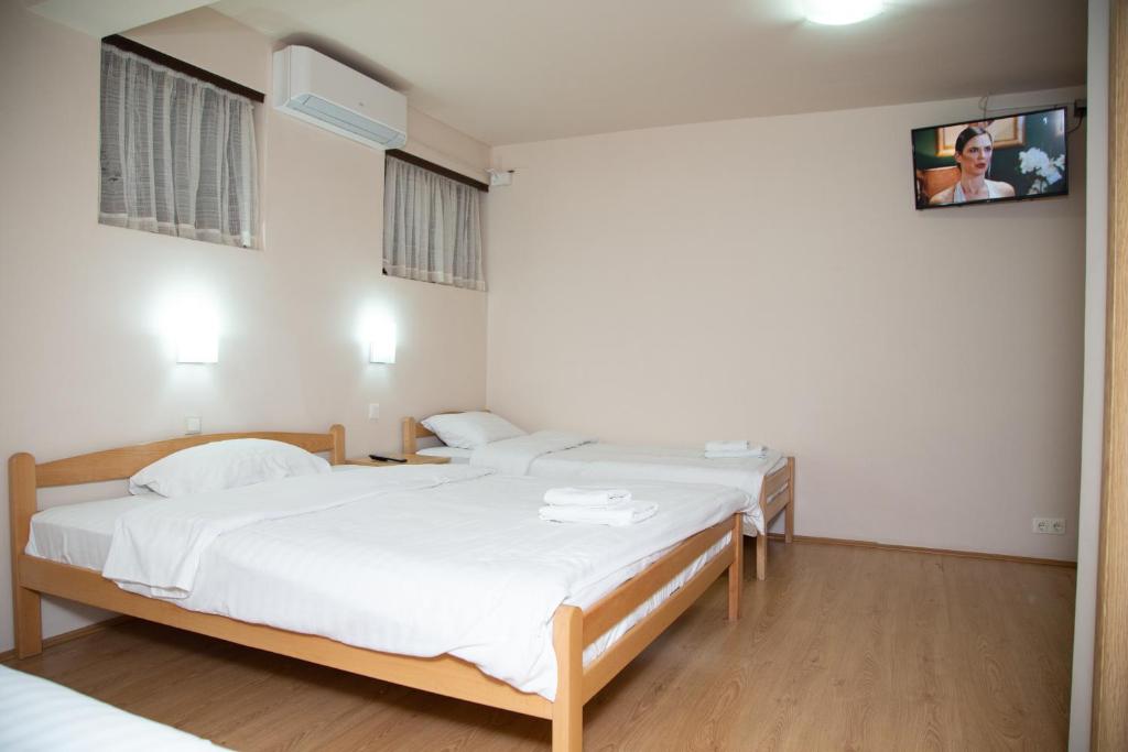 Postel nebo postele na pokoji v ubytování Motel Imperija
