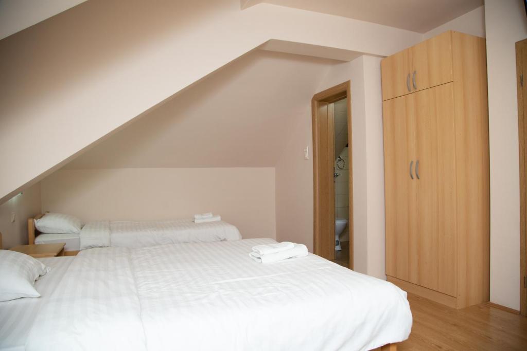 Postel nebo postele na pokoji v ubytování Motel Imperija