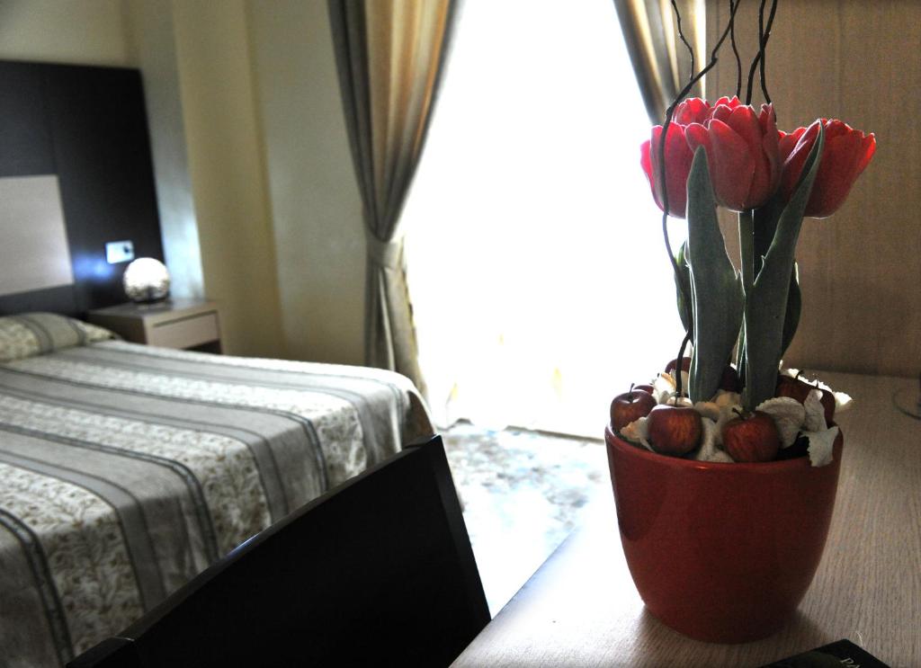 A bed or beds in a room at Hotel Gabbiano