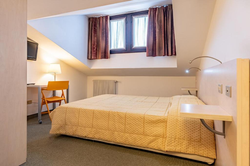 Postel nebo postele na pokoji v ubytování Hotel Alaska