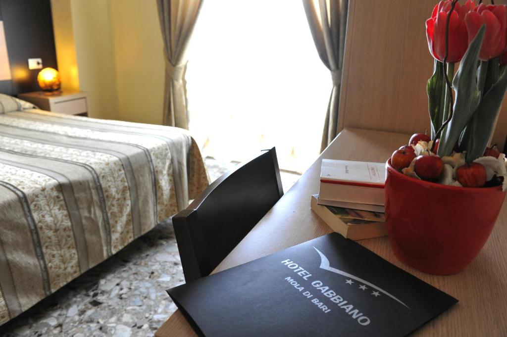 A bed or beds in a room at Hotel Gabbiano