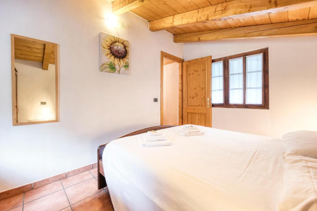 Posteľ alebo postele v izbe v ubytovaní Incanto Walser Apartments Ronco