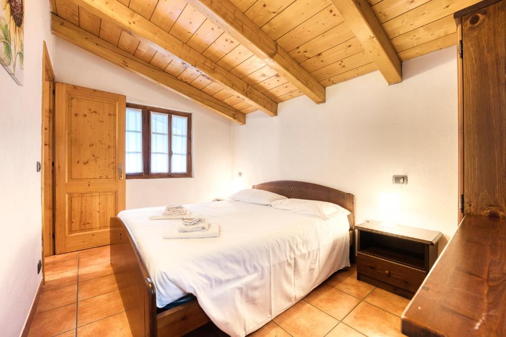 Posteľ alebo postele v izbe v ubytovaní Incanto Walser Apartments Ronco