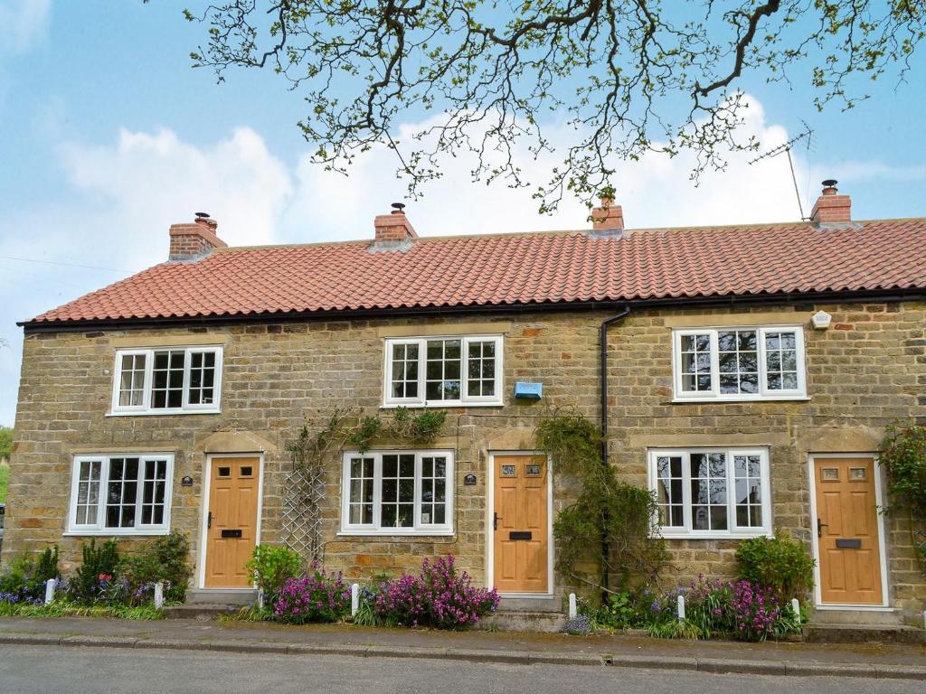 a brick house with a red roof at Keldholme Cottages 2 - Uk11488 in Kirkbymoorside