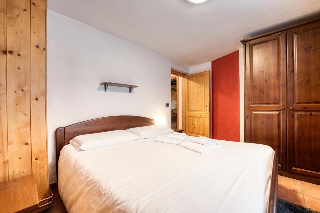 Posteľ alebo postele v izbe v ubytovaní Incanto Walser Apartments Ronco