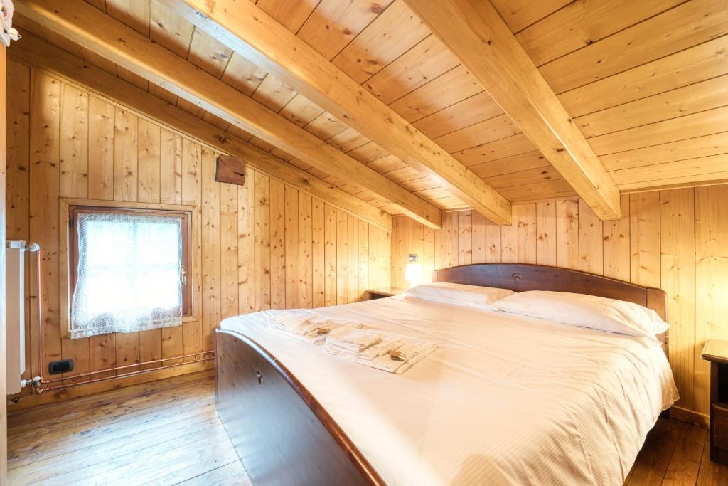 Posteľ alebo postele v izbe v ubytovaní Incanto Walser Apartments Ronco