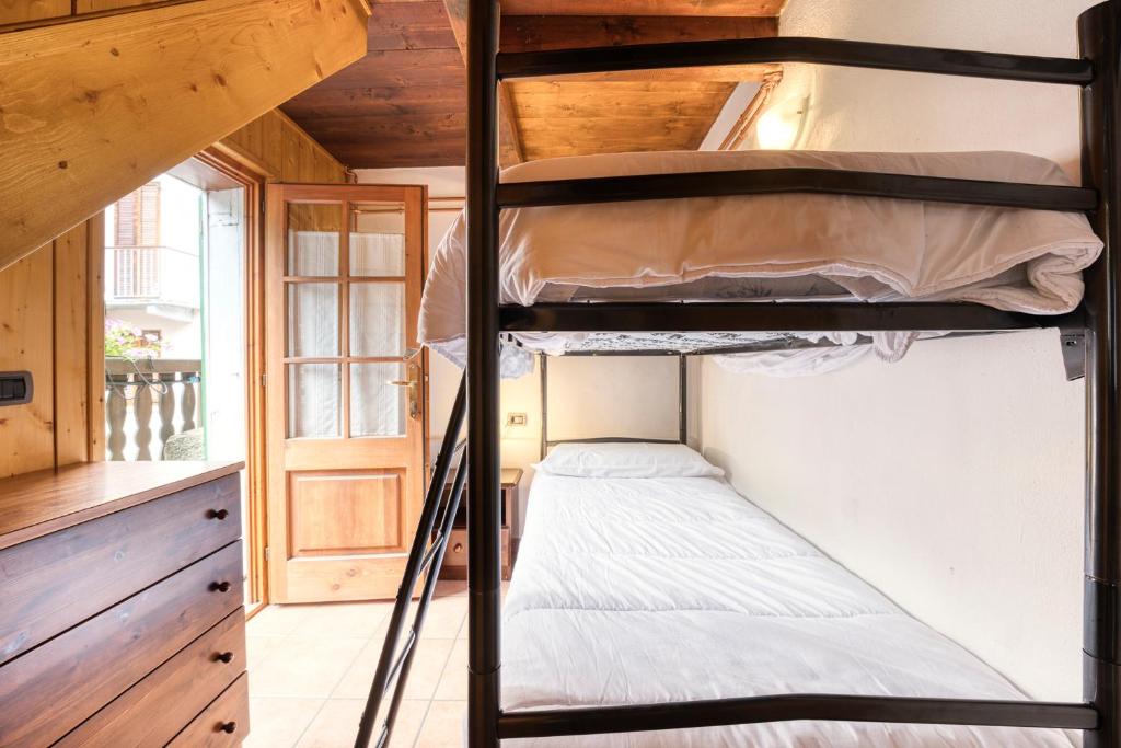 Posteľ alebo postele v izbe v ubytovaní Incanto Walser Apartments Ronco