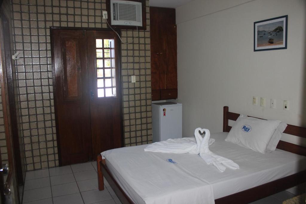 Postel nebo postele na pokoji v ubytování Hotel Rey