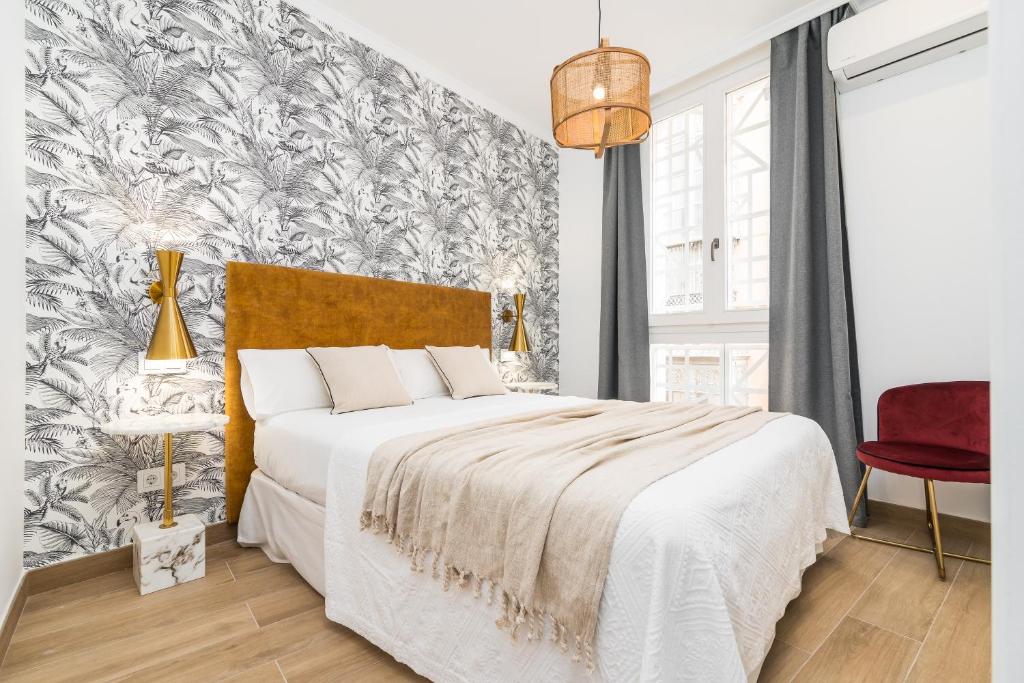 Postel nebo postele na pokoji v ubytování iloftmalaga Santa María