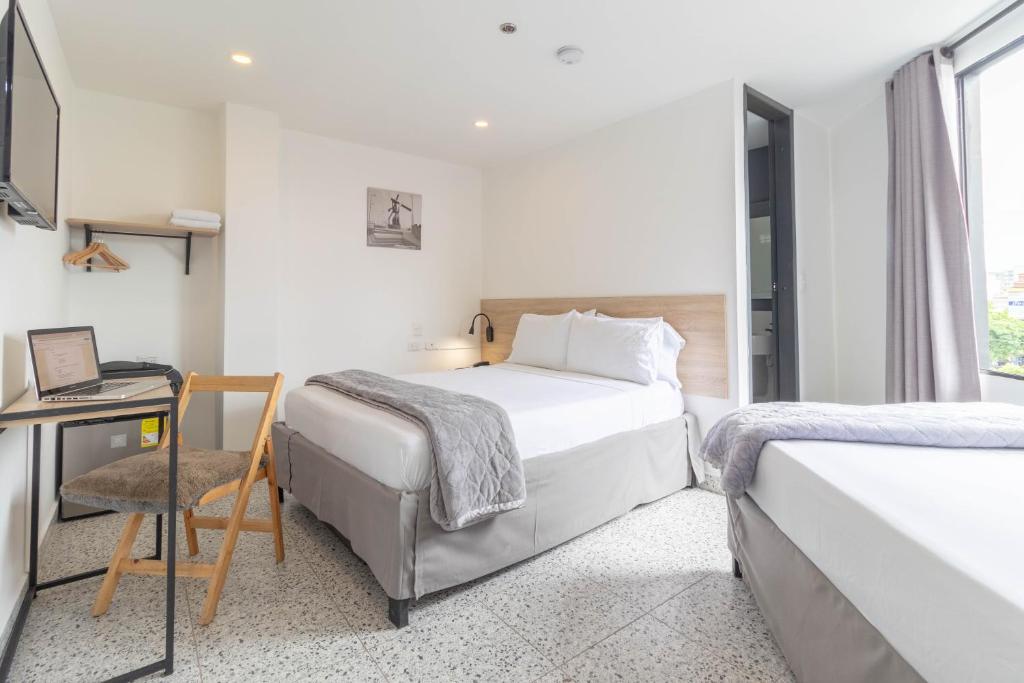 Postel nebo postele na pokoji v ubytování Bianco Hotel Boutique