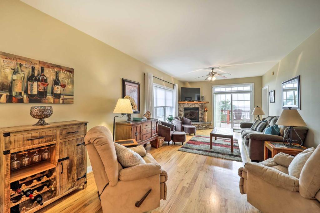 a living room with two chairs and a fireplace at Scenic Views! Ski-In/Ski-Out Condo in Beech Mtn in Beech Mountain