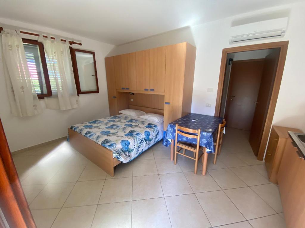 Postel nebo postele na pokoji v ubytování Il Tombolo