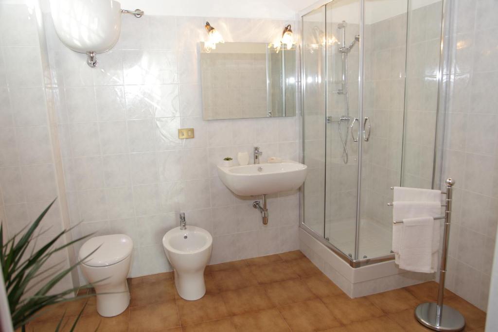 a bathroom with a sink and a toilet and a shower at I Due Principi in San Marco Argentano