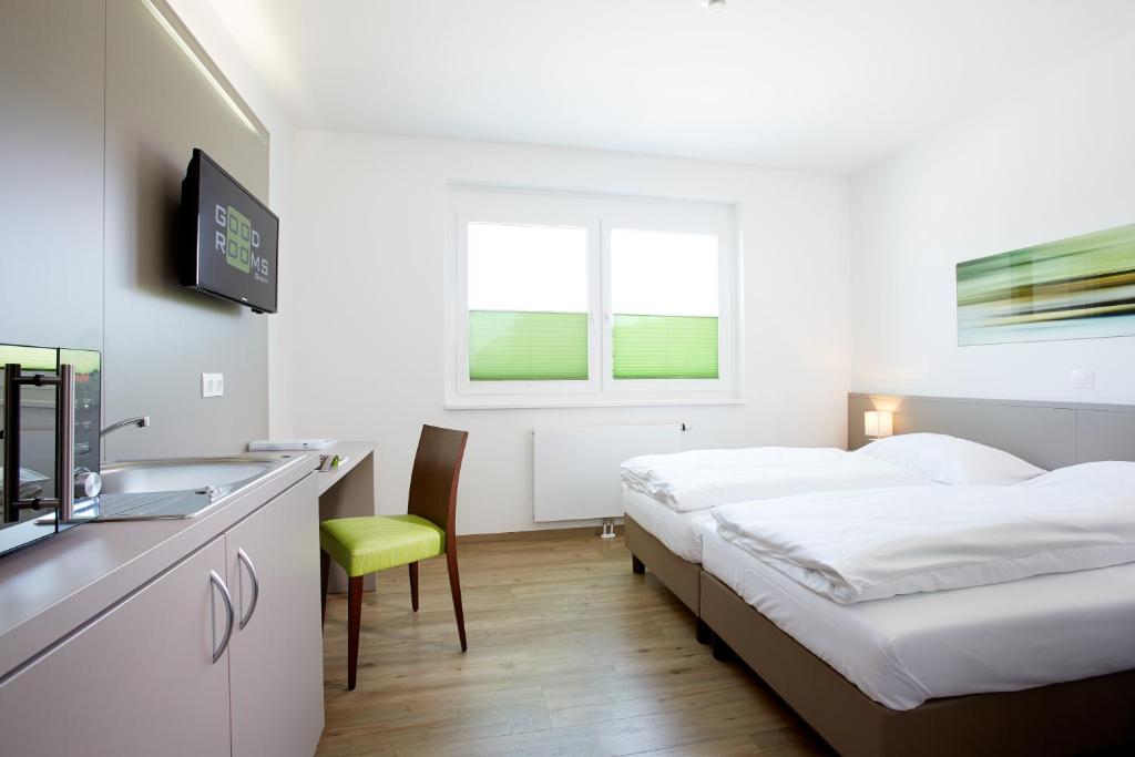 Postel nebo postele na pokoji v ubytování Good Rooms GmbH Guntramsdorf