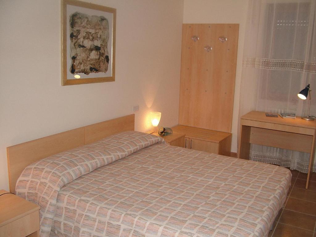 Postel nebo postele na pokoji v ubytování B&B & Residence Pozzo Misseo