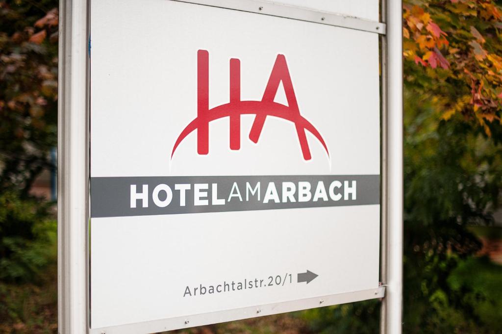 a sign for a hotel amarach at Hotel Garni am Arbach in Eningen unter Achalm