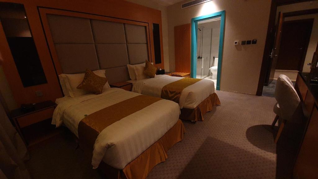 Letto o letti in una camera di Al Rayyan Tower