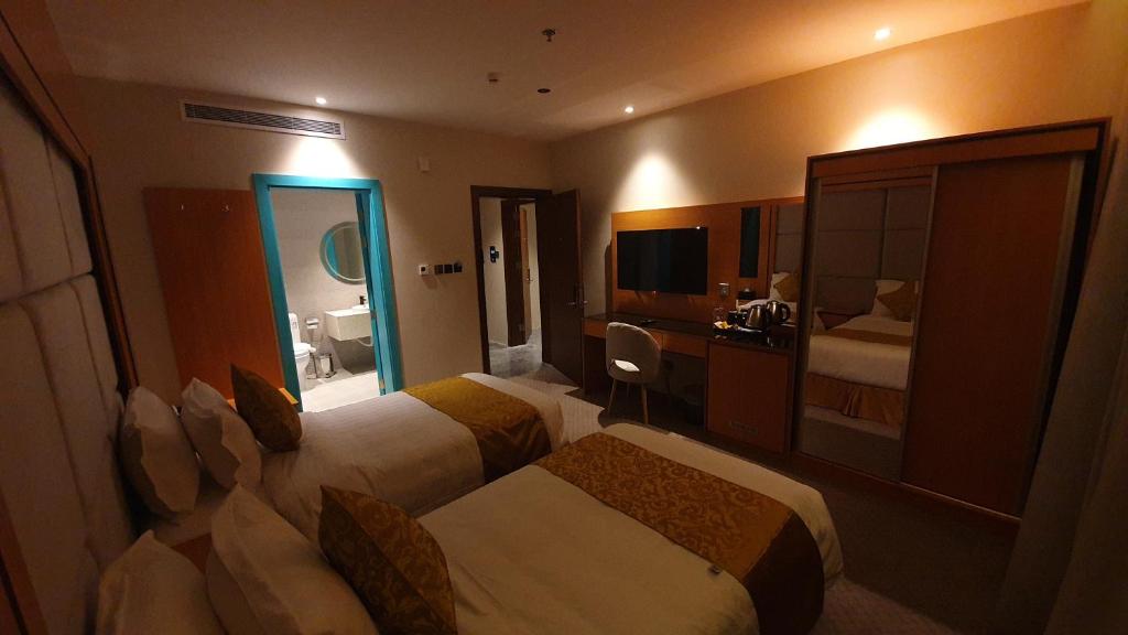 Letto o letti in una camera di Al Rayyan Tower