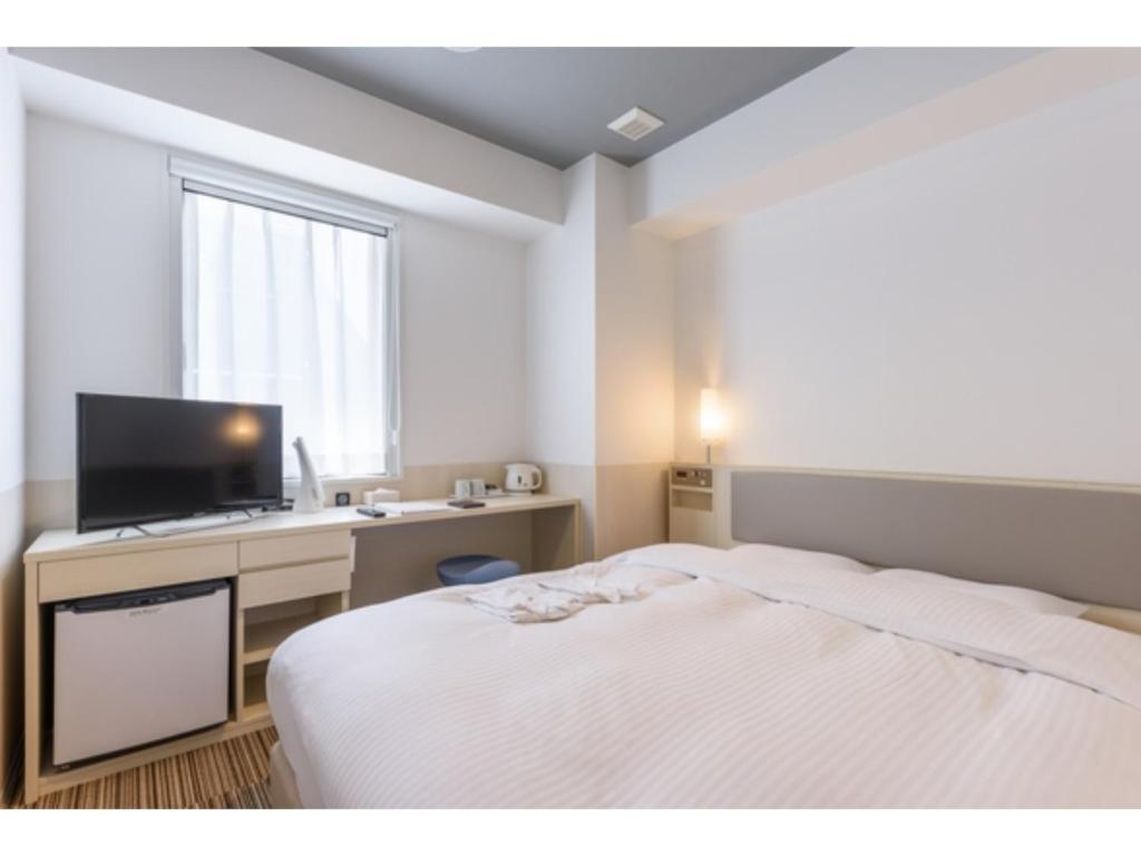 Säng eller sängar i ett rum på Belken Hotel Kanda - Vacation STAY 80916v