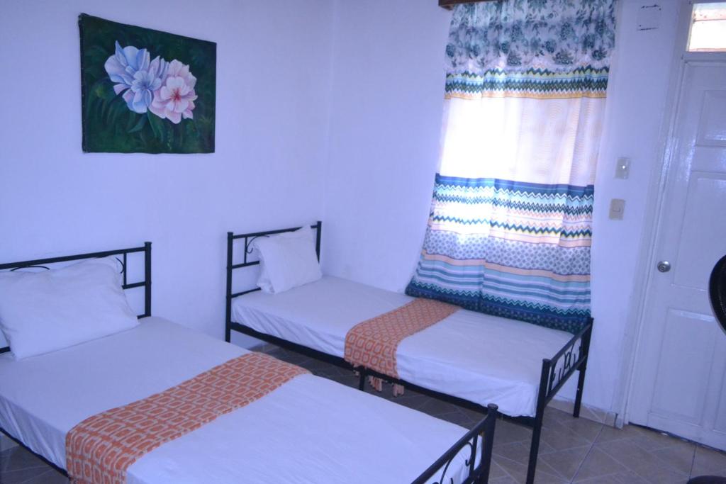 Postel nebo postele na pokoji v ubytování Habitation Des Lauriers