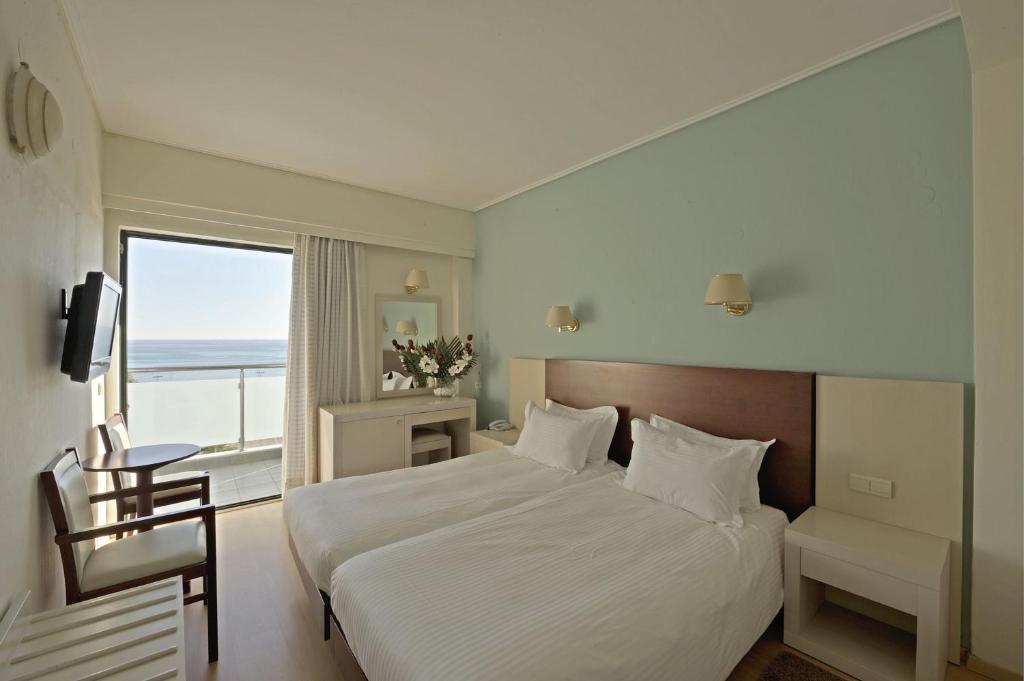Postel nebo postele na pokoji v ubytování Esperia Hotel