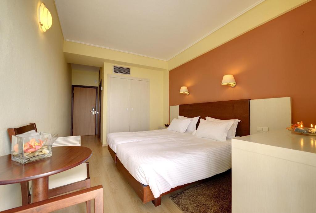 Postel nebo postele na pokoji v ubytování Esperia Hotel