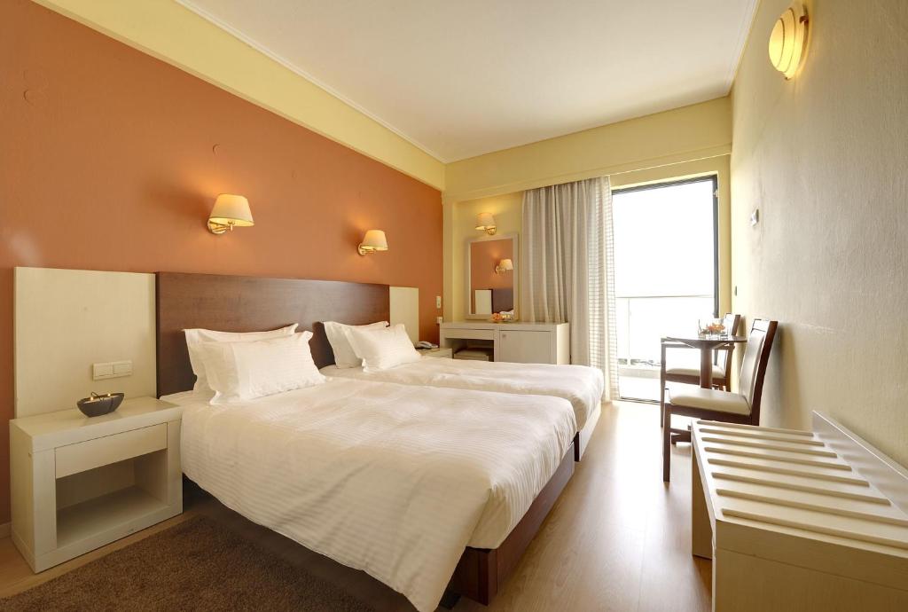 Postel nebo postele na pokoji v ubytování Esperia Hotel
