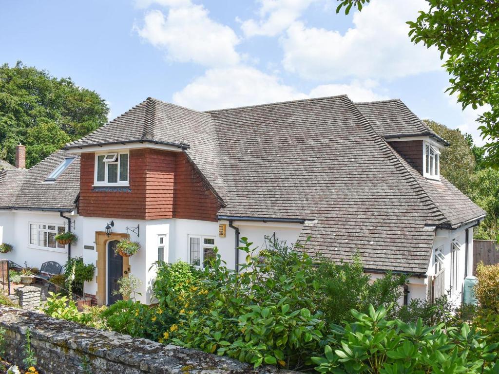 a white house with a brown roof at Ashlea At Amberley in Sidmouth