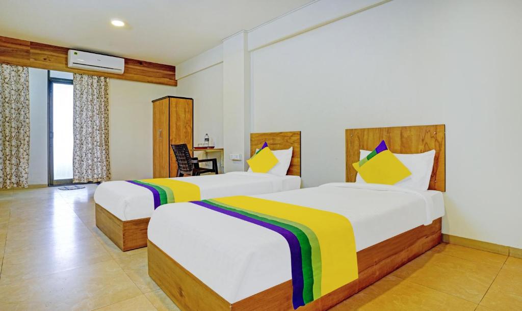 Postel nebo postele na pokoji v ubytování Itsy Hotels Oasis Pride