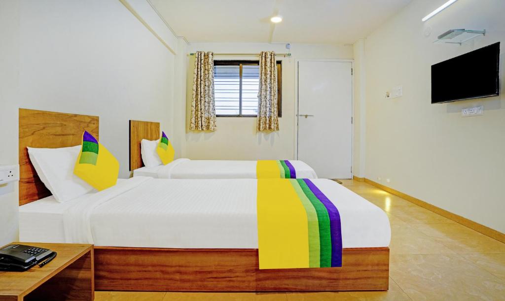 Postel nebo postele na pokoji v ubytování Itsy Hotels Oasis Pride
