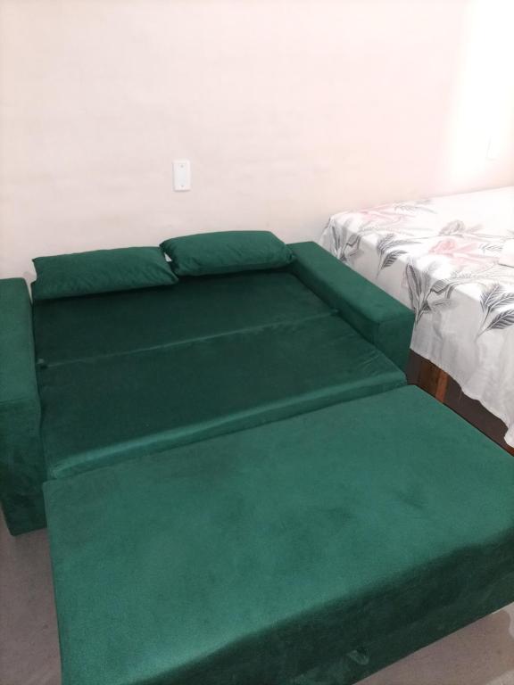 En eller flere senge i et værelse på pôr do sol - chalés